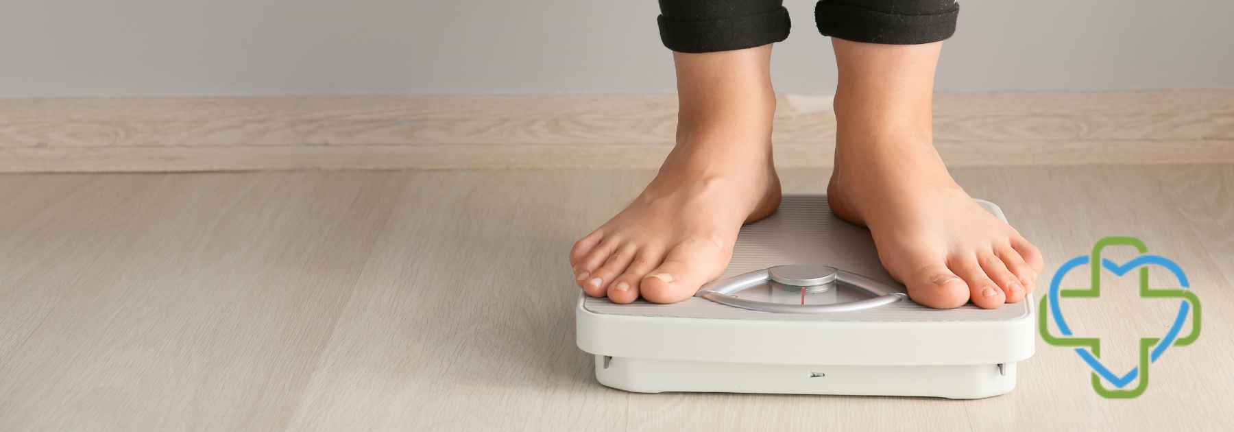 person in bare feet standing on scales