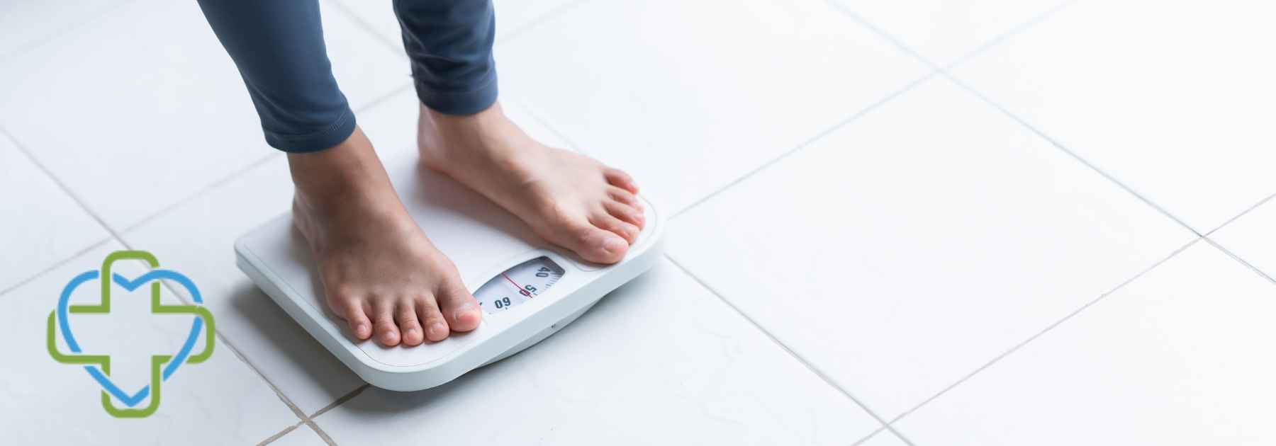 person in bare feet and leggings standing on scales