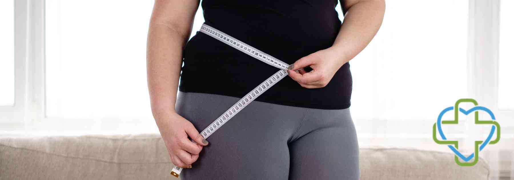 overweight woman with measuring tape