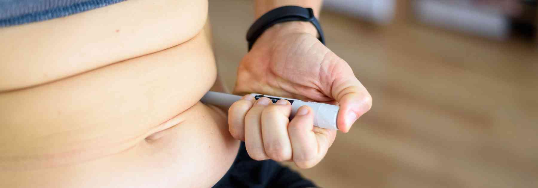 person injecting weight loss injection