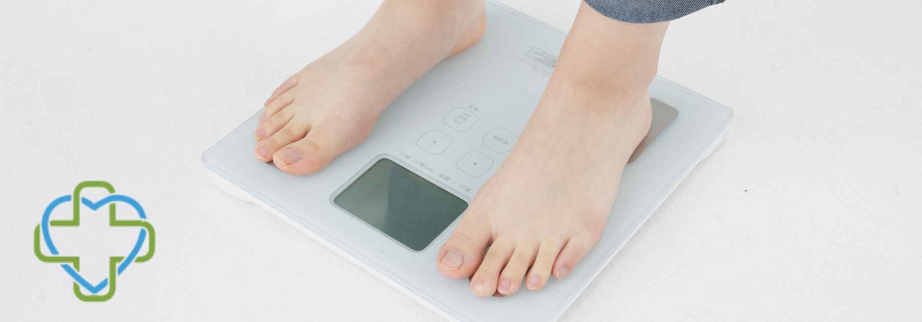 person in bare feet standing on scales