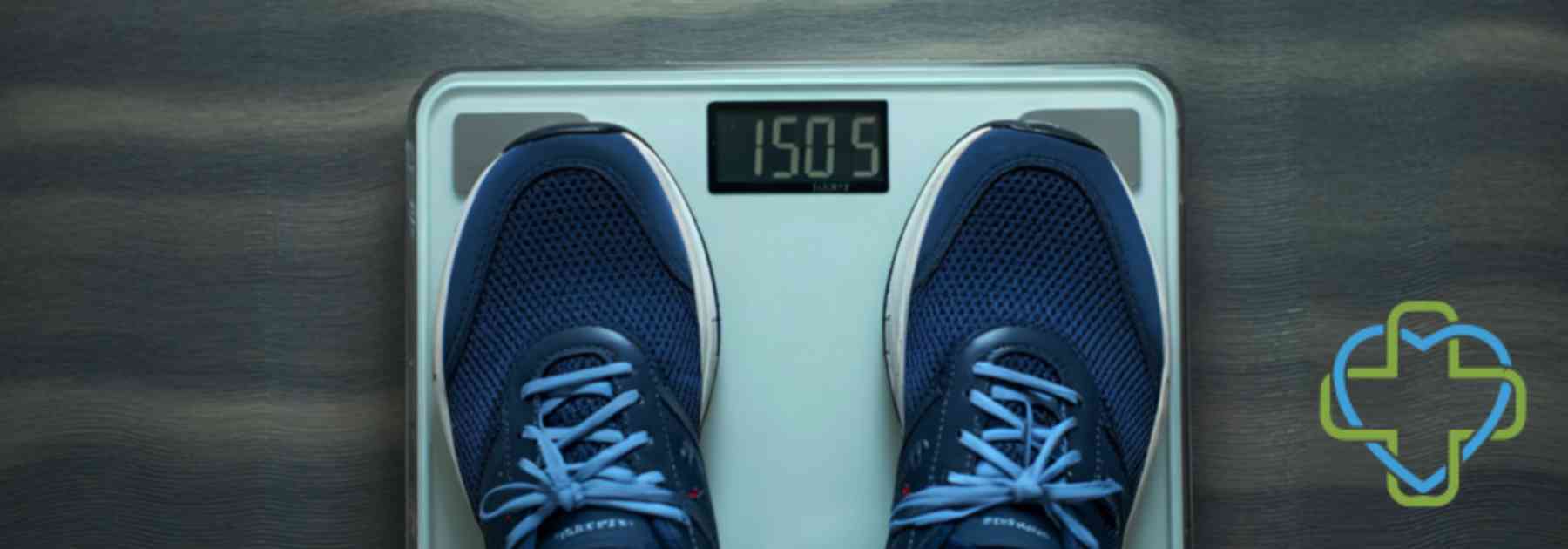 person in blue shoes standing on scales