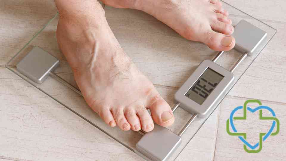 person in bare feet standing on scales