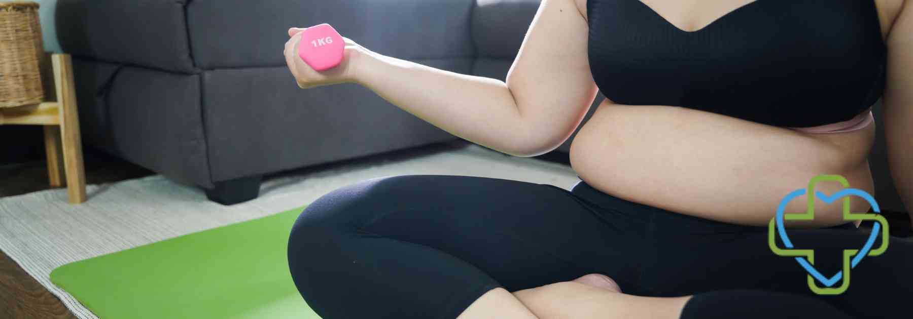 overweight woman in workout gear lifting weight