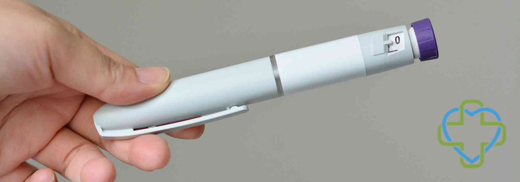 person holding weight loss injection