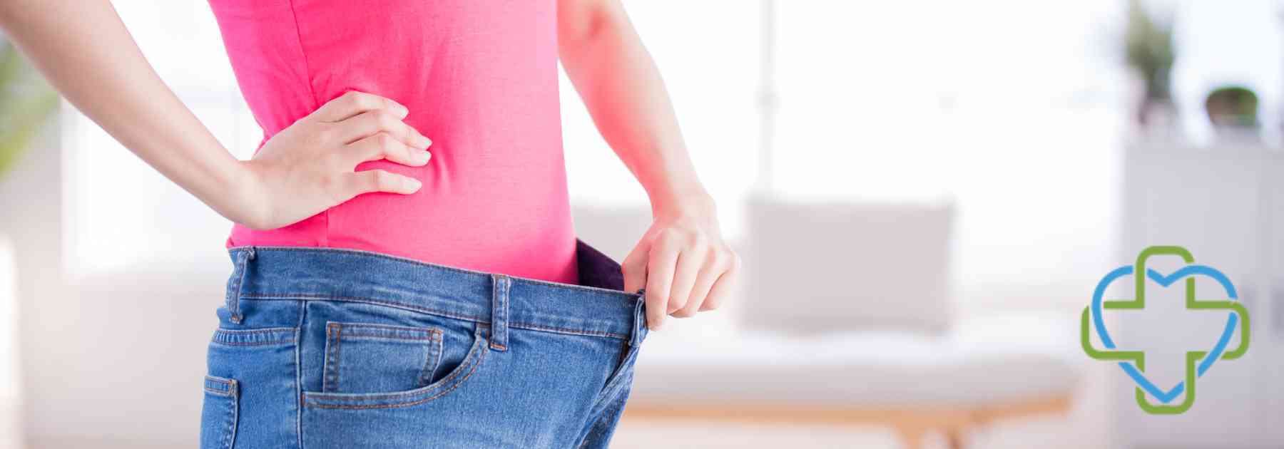 person in pink shirt wearing jeans too big
