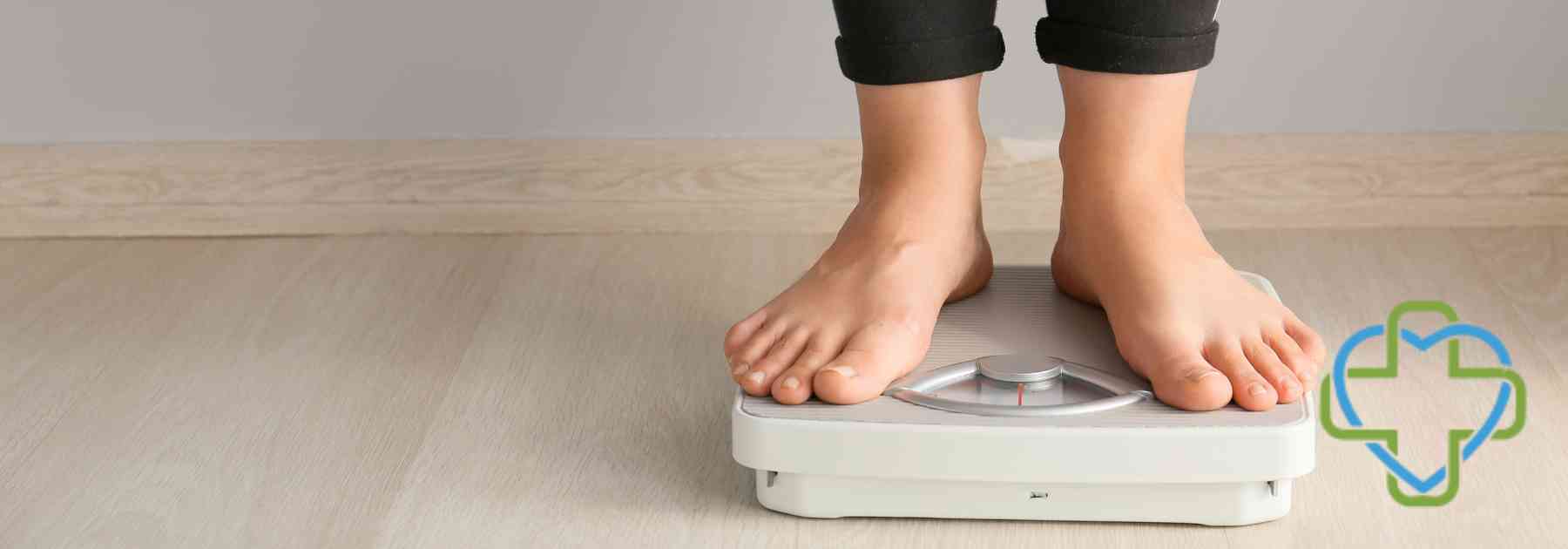 person in bare feet standing on scales