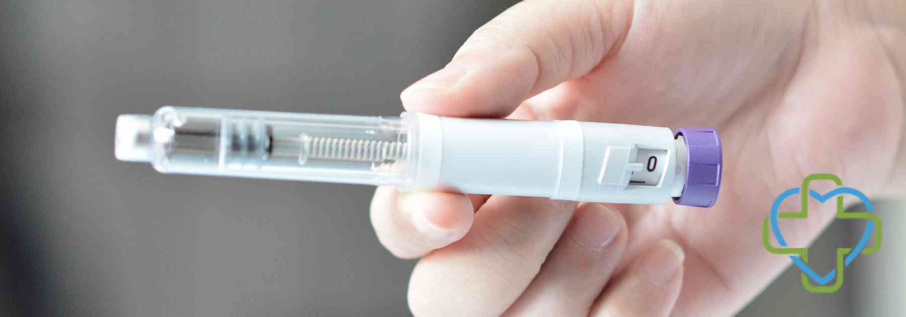 close-up of person holding weight loss injection