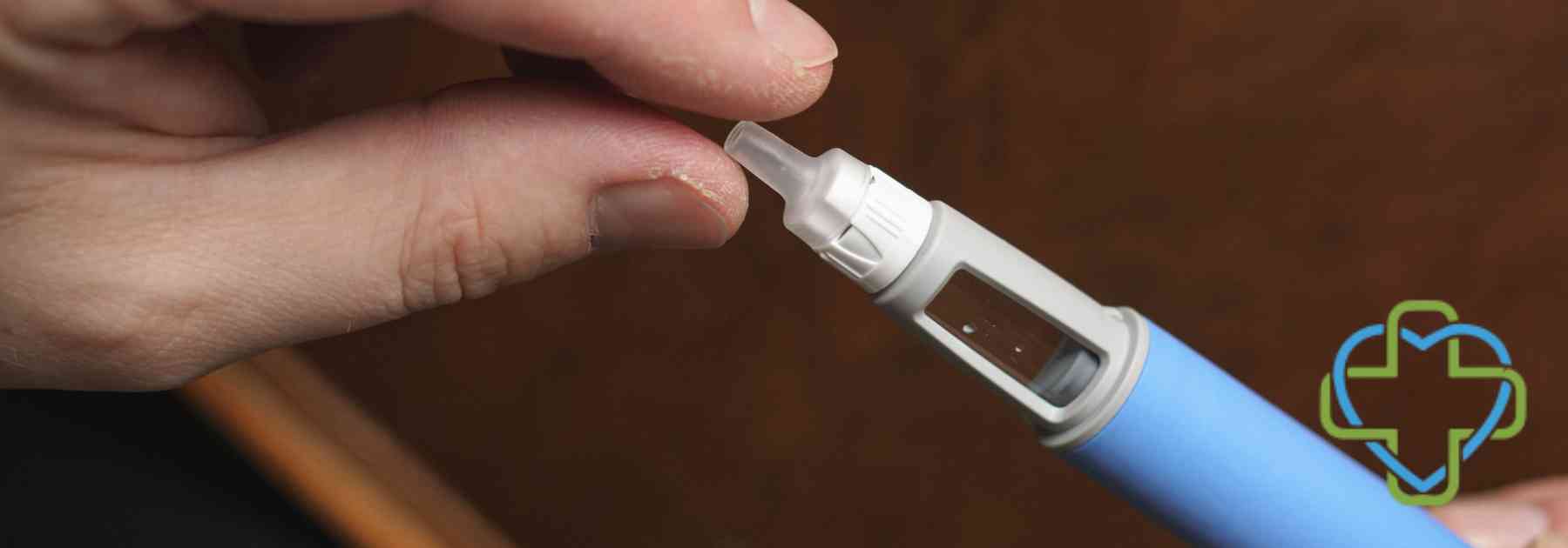 person holding weight loss injection