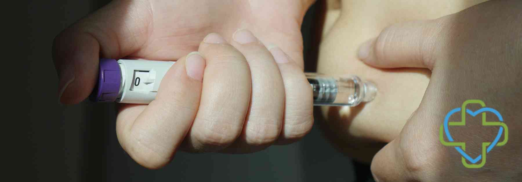 person using weight loss injection in dark room