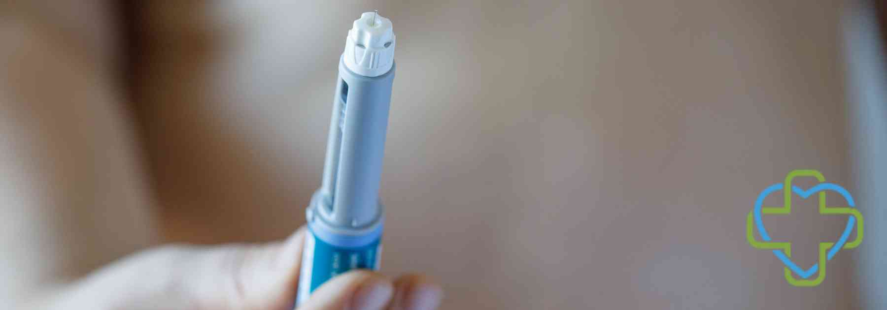 close-up of person holding weight loss injection