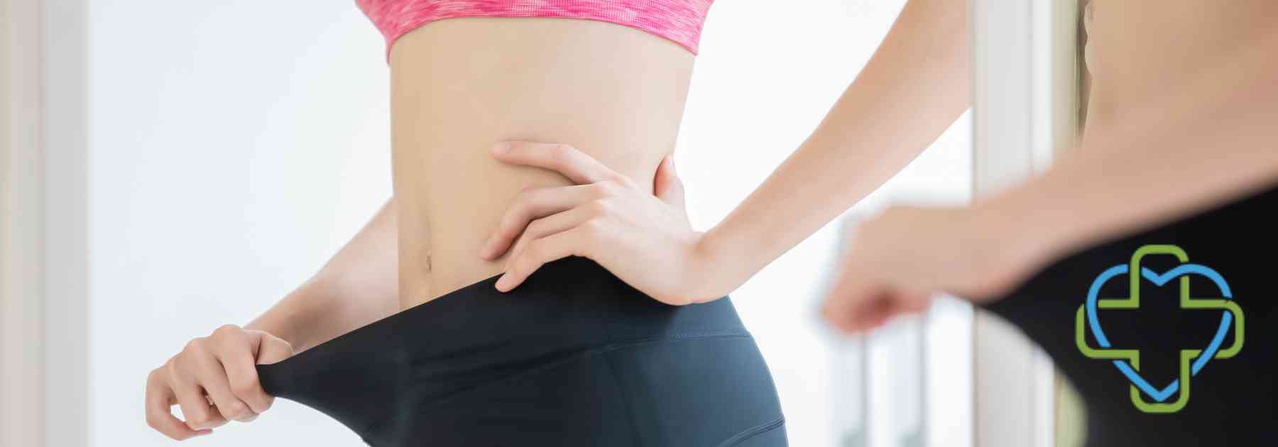 woman looking in mirror wearing leggings too big