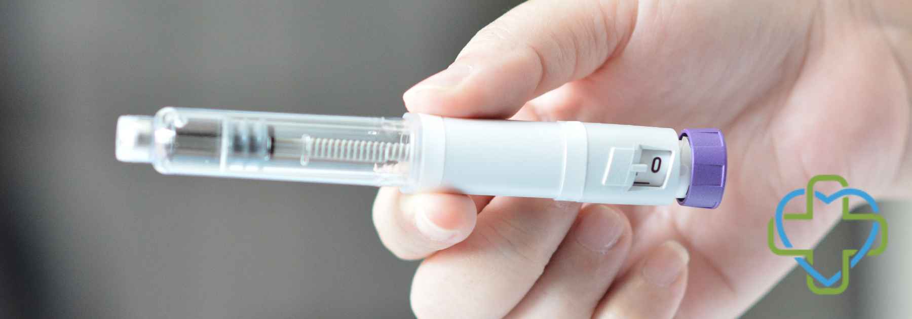 close-up of person holding weight loss injection