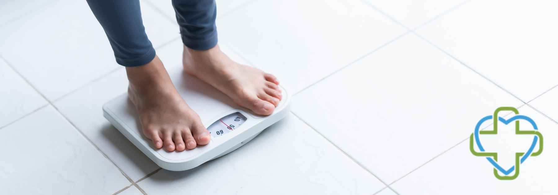 person in bare feet standing on scales