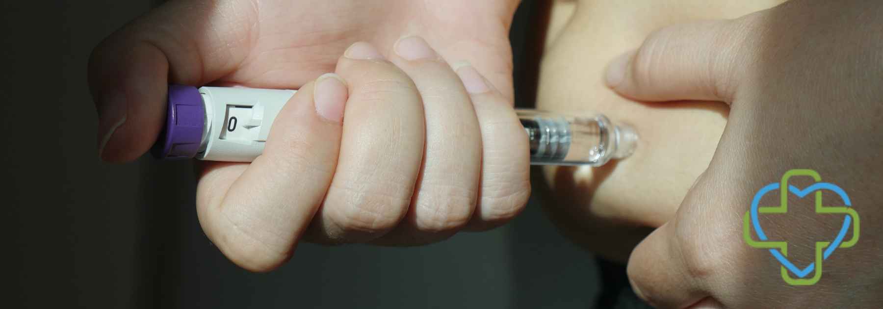 person using weight loss injection in dark room