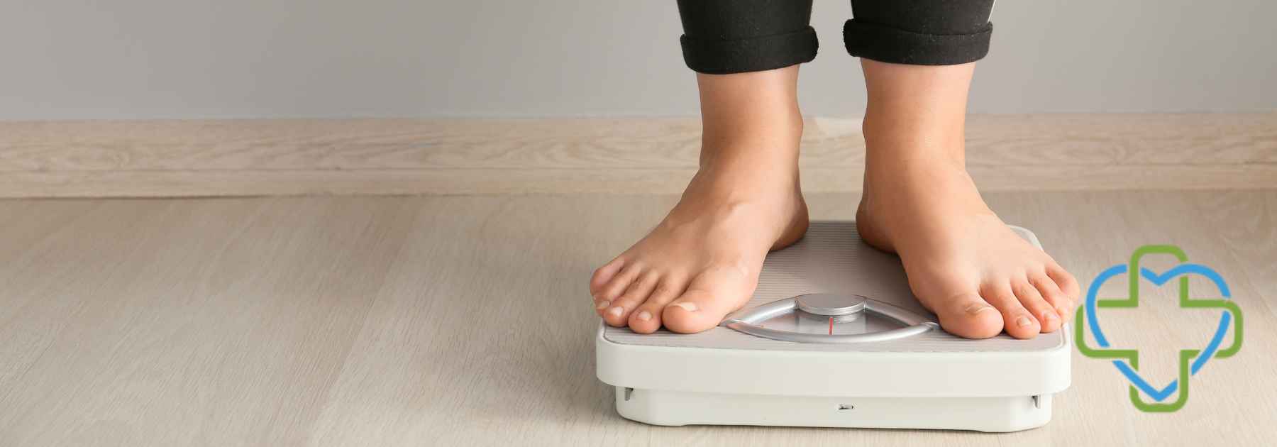 person in bare feet standing on scales